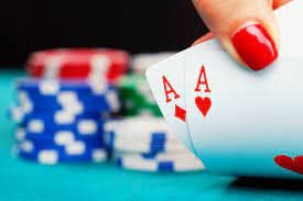 Live Andar Bahar dealer at jagotogel login, showing card placement and betting buttons